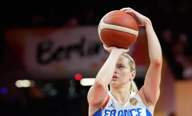 France's Marine Johannes shoots during the Women's Basketball World Cup match between France and Korea in Berlin, Saturday, Sept. 5, 2026. (AP Photo/Ebrahim Noroozi)