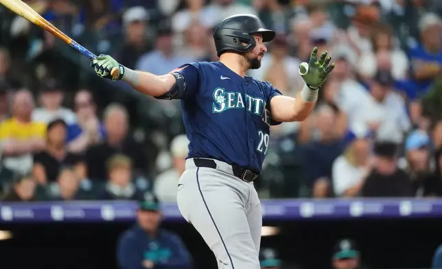 Seattle Mariners' Cal Raleigh strikes out against Colorado Rockies starting pitcher Gabriel Hughes in the third inning of a baseball game Friday, Sept. 18, 2026, in Denver. (AP Photo/David Zalubowski)