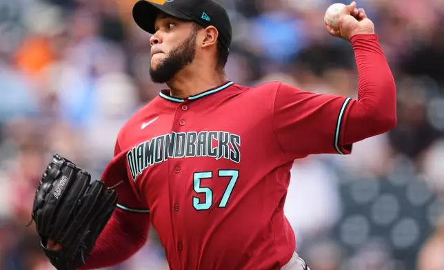 Arizona Diamondbacks starting pitcher Eduardo Rodriguez works against the Colorado Rockies in the first inning of a baseball game Thursday, Sept. 24, 2026, in Denver. (AP Photo/David Zalubowski)