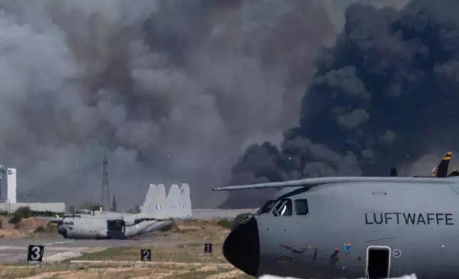 Smoke rises after a Hellenic Air Force F-4 Phantom fighter jet crashed, during the Athens Flying Week airshow at Tanagra Air Force Base, north of Athens, Greece, Saturday, Sept. 5, 2026. (AP Photo)