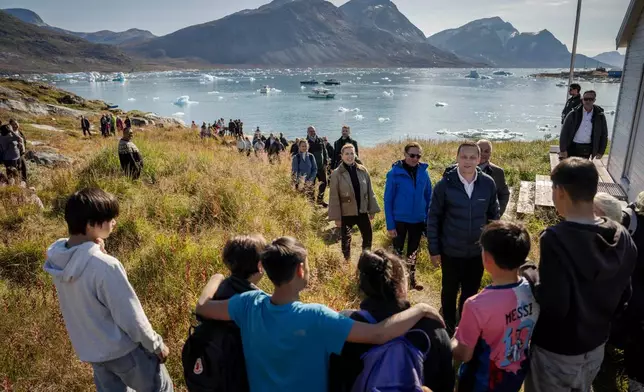 Denmark’s Prime Minister Mette Frederiksen, forth right, and Greenlandic Prime Minister Jens-Frederik Nielsen, front, visit Qoornoq, Greenland Sunday, Sept. 6, 2026. (Mads Claus Rasmussen/Ritzau Scanpix via AP)