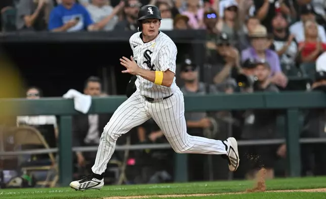 Chicago White Sox's Sam Antonacci runs home to score on a Munetaka Murakami single during the fifth inning of a baseball game against the Minnesota Twins, Sunday, Sept. 6, 2026, in Chicago. (AP Photo/Paul Beaty)