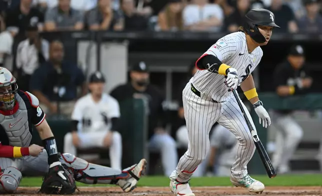 Chicago White Sox's Munetaka Murakami, right, of Japan, watches his RBI single during the fifth inning of a baseball game against the Minnesota Twins, Sunday, Sept. 6, 2026, in Chicago. (AP Photo/Paul Beaty)