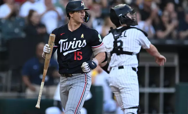 Minnesota Twins' Luke Keaschall (15) reacts after striking out during the first inning of a baseball game against the Chicago White Sox, Sunday, Sept. 6, 2026, in Chicago. (AP Photo/Paul Beaty)