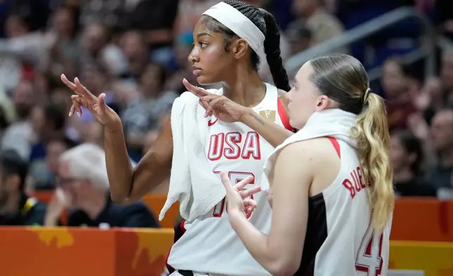 Angel Reese, of the United States, left, and Paige Bueckers, react during the Women's Basketball World Cup quarterfinal match between the United States and Hungary in Berlin, Thursday, Sept. 10, 2026. (AP Photo/Ebrahim Noroozi)