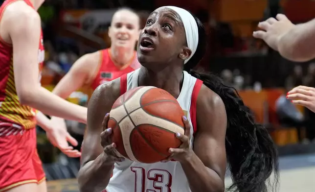 Jackie Young, of the United States, goes for a shot during the Women's Basketball World Cup quarterfinal match between the United States and Hungary in Berlin, Thursday, Sept. 10, 2026. (AP Photo/Ebrahim Noroozi)