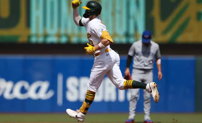 Athletics' Henry Bolte jogs around the bases after hitting a solo home run during the third inning of a baseball game against the Toronto Blue Jays Wednesday, Sept. 9, 2026, in West Sacramento, Calif. (AP Photo/Scott Marshall)