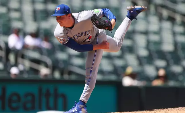 Toronto Blue Jays pitcher Louis Varland throws to an Athletics batter during the eighth inning of a baseball game Wednesday, Sept. 9, 2026, in West Sacramento, Calif. (AP Photo/Scott Marshall)