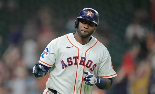 Houston Astros' Yordan Alvarez celebrates after hitting a home run against the Kansas City Royals during the fifth inning of a baseball game Thursday, Sept. 17, 2026, in Houston. (AP Photo/David J. Phillip)