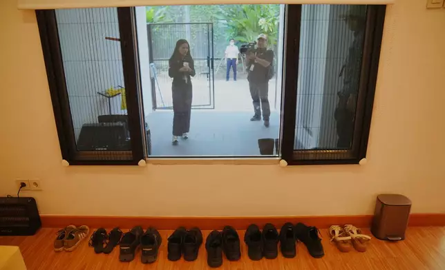 Rows of shoes are seen at a controversial luxury compound inside a penitentiary during an inspection by lawmakers to Cibinong Prison in Bogor, West Java, Indonesia, Wednesday, Sept. 30, 2026. (AP Photo/Tatan Syuflana)