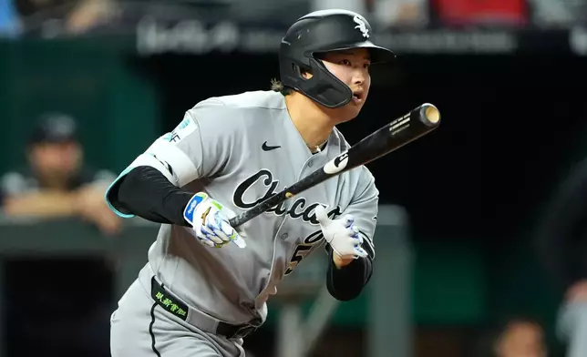 Chicago White Sox's Munetaka Murakami watches his RBI double during the third inning of a baseball game against the Kansas City Royals, Wednesday, Sept. 23, 2026, in Kansas City, Mo. (AP Photo/Charlie Riedel)