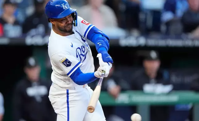 Kansas City Royals' Maikel Garcia hits a two-run single during the first inning of a baseball game against the Chicago White Sox, Wednesday, Sept. 23, 2026, in Kansas City, Mo. (AP Photo/Charlie Riedel)