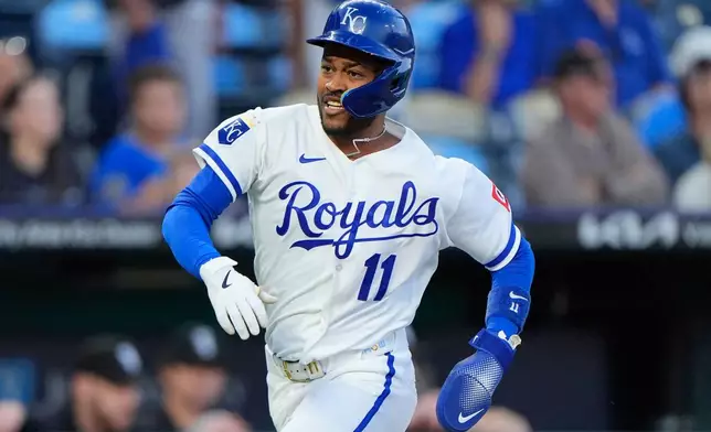 Kansas City Royals' Maikel Garcia runs home to score on an RBI single hit by Vinnie Pasquantino during the first inning of a baseball game against the Chicago White Sox, Wednesday, Sept. 23, 2026, in Kansas City, Mo. (AP Photo/Charlie Riedel)