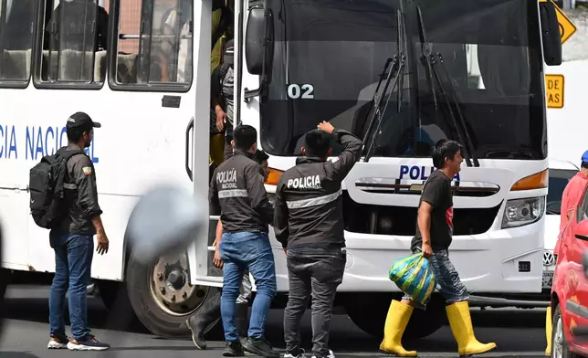 Crew members from the boat Maria Candelaria arrive at a police facility in Manta, Ecuador, Monday, Sept. 7, 2026, after being returned to the country following the interception of the vessel by U.S. authorities on suspicion of alleged drug trafficking. (AP Photo/Ariel Ochoa)