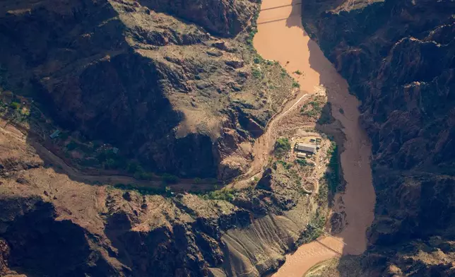 Bright Angel Canyon, damaged by flash floods, runs into the Colorado River in the Grand Canyon, Monday, Aug. 31, 2026, at Grand Canyon National Park, Ariz. (AP Photo/John Locher)