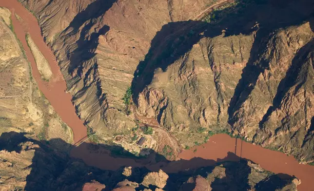 Bright Angel Canyon, the scene of flash floods, runs into the Colorado River in the Grand Canyon, Monday, Aug. 31, 2026, at Grand Canyon National Park, Ariz. (AP Photo/John Locher)