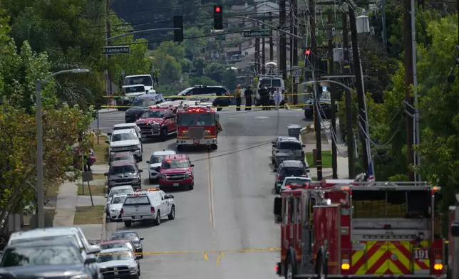 Firetrucks blocked off roads following a reported chemical leak, Tuesday, Sept. 8, 2026, in La Habra, southern Calif. (AP Photo/Jae C. Hong)