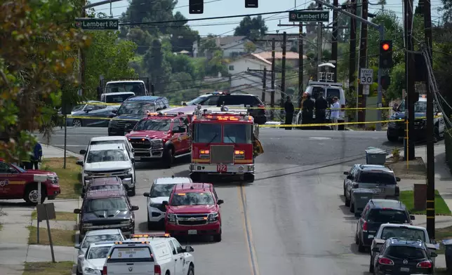 Firetrucks blocked off roads following a reported chemical leak, Tuesday, Sept. 8, 2026, in La Habra, southern Calif. (AP Photo/Jae C. Hong)