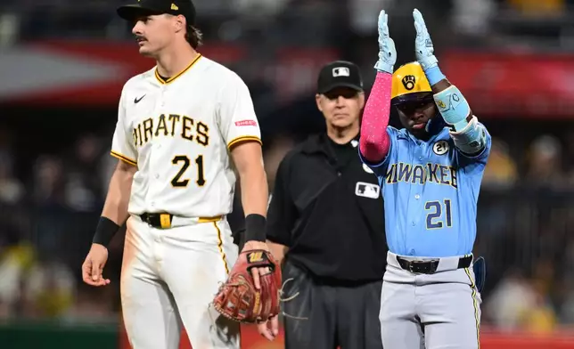 Milwaukee Brewers' Luis Lara celebrates after hitting an RBI double during the sixth inning of a baseball game against the Pittsburgh Pirates, Tuesday, Sept. 15, 2026, in Pittsburgh. (AP Photo/David Dermer)