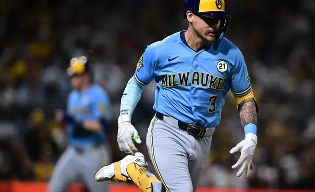 Milwaukee Brewers' Joey Ortiz runs to first base after hitting a two-RBI single during the sixth inning of a baseball game against the Pittsburgh Pirates, Tuesday, Sept. 15, 2026, in Pittsburgh. (AP Photo/David Dermer)