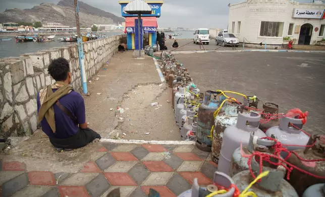 People fill their gas cans at a station in Aden, Yemen, Tuesday, Sept. 15, 2026. (AP Photo/Abdulnasser Alseddik)