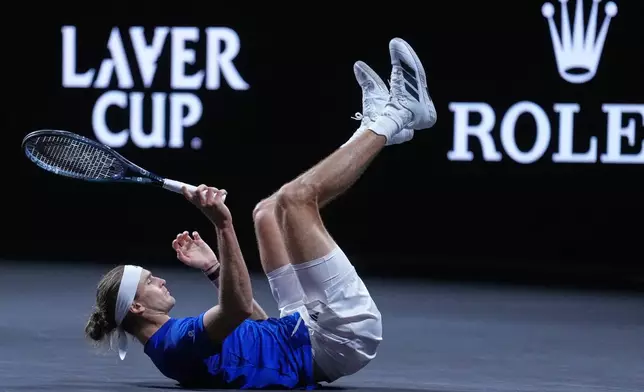 Team Europe's Alexander Zverev slips and falls during a rally against Team World's Alex De Minaur during a Laver Cup tennis tournament match in London, Saturday, Sept. 26, 2026. (AP Photo/Maja Smiejkowska)