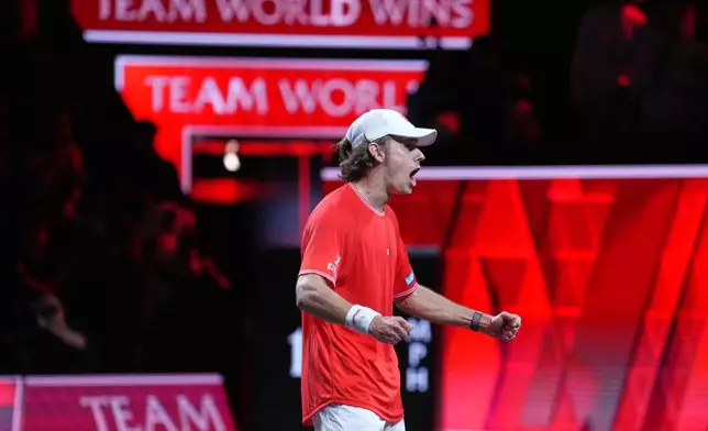 Team World's Alex De Minaur celebrates after beating Team Europe's Alexander Zverev in a Laver Cup tennis tournament match in London, Saturday, Sept. 26, 2026. (AP Photo/Maja Smiejkowska)