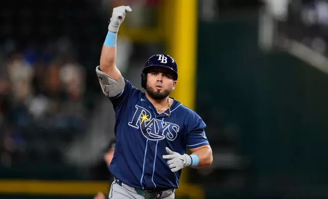 Tampa Bay Rays' Jonathan Aranda celebrates his three-run home run during the 10th inning of a baseball game against the Texas Rangers Saturday, Sept. 5, 2026, in Arlington, Texas. (AP Photo/Tony Gutierrez)