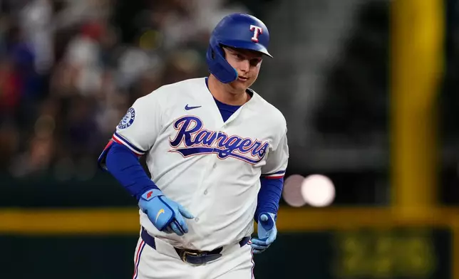 Texas Rangers' Joc Pederson rounds the bases after hitting a solo home run during the sixth inning of a baseball game against the Tampa Bay Rays Saturday, Sept. 5, 2026, in Arlington, Texas. (AP Photo/Tony Gutierrez)