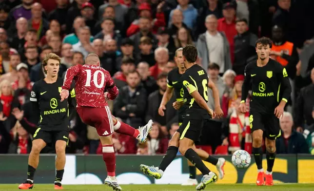 Liverpool's Alexis Mac Allister scores his side's second goal during the Champions League opening phase soccer match between Liverpool and Atletico Madrid in Liverpool, England, Wednesday, Sept. 9, 2026. (AP Photo/Dave Thompson)