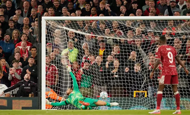 Atletico Madrid's goalkeeper Jan Oblak receives the second goal by Liverpool's Alexis Mac Allister during the Champions League opening phase soccer match between Liverpool and Atletico Madrid in Liverpool, England, Wednesday, Sept. 9, 2026. (AP Photo/Dave Thompson)