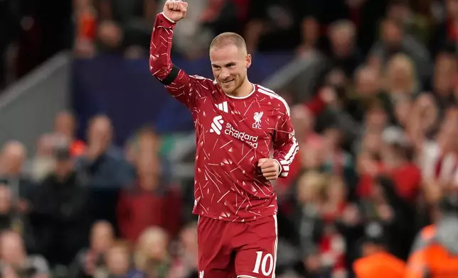 Liverpool's Alexis Mac Allister celebrates after scoring his side's second goal during the Champions League opening phase soccer match between Liverpool and Atletico Madrid in Liverpool, England, Wednesday, Sept. 9, 2026. (AP Photo/Dave Thompson)