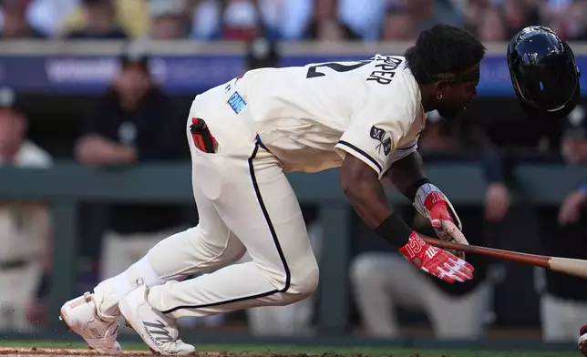 Minnesota Twins' Kaelen Culpepper falls after being hit by a pitch during the third inning of a baseball game against the Cleveland Guardians in Minneapolis, Saturday, Sept. 12, 2026. (AP Photo/Abbie Parr)
