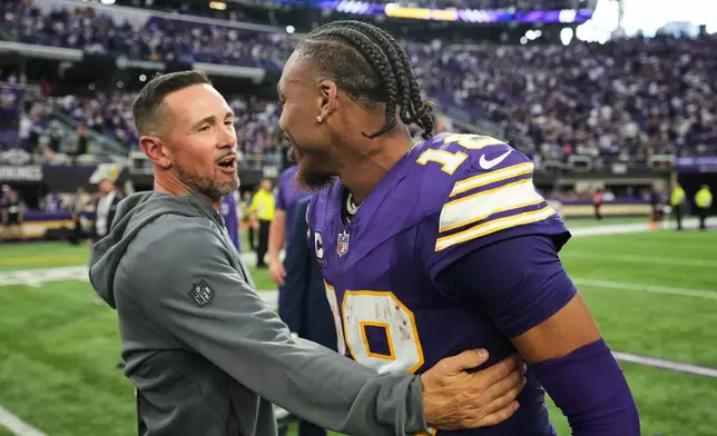 Green Bay Packers head coach Matt LaFleur, left, and Minnesota Vikings wide receiver Justin Jefferson (18) greet each other after an NFL football game, Sunday, Sept. 13, 2026, in Minneapolis, Minn. (AP Photo/Abbie Parr)