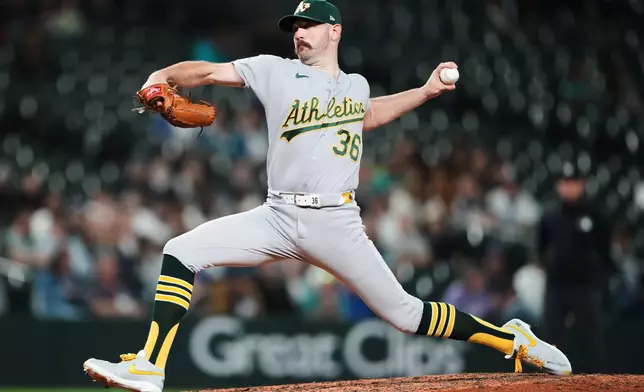 Athletics relief pitcher Hogan Harris throws against the Seattle Mariners during the ninth inning of a baseball game, Thursday, Sept. 3, 2026, in Seattle. (AP Photo/Lindsey Wasson)