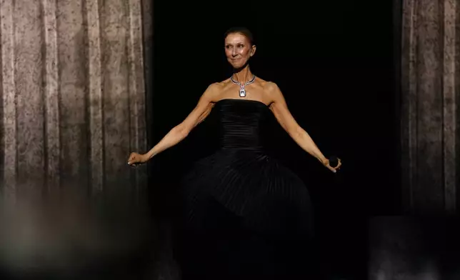 Singer Celine Dion performs during the opening concert of her 'Celine Dion Paris 2026' residency at the Plenitude Arena in Nanterre, outside Paris, Saturday, Sept. 12, 2026. (AP Photo/Aurelien Morissard)
