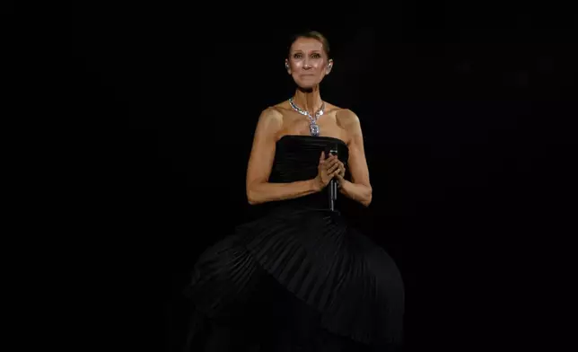 Singer Celine Dion performs during the opening concert of her "Celine Dion Paris 2026" residency at the Plenitude Arena in Nanterre, France, outside Paris, Saturday, Sept. 12, 2026. (AP Photo/Aurelien Morissard)