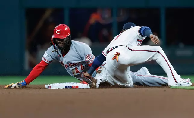 Cincinnati Reds' Elly De La Cruz (44) steals second base against Atlanta Braves second baseman Ozzie Albies (1) during the first inning of a baseball game, Tuesday, Sept. 22, 2026, in Atlanta. (AP Photo/Erik S. Lesser)