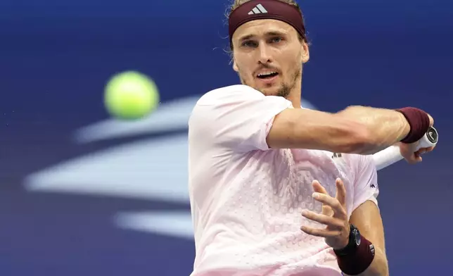 Alexander Zverev, of Germany, returns the ball to Ben Shelton, of the United States, during the men's singles final of the U.S. Open tennis championships Sunday, Sept. 13, 2026, in New York. (AP Photo/Adam Hunger)