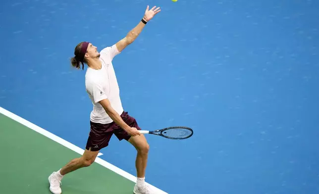 Alexander Zverev, of Germany, serves the ball to Karen Khachanov, of Russia, during the men's singles semifinals of the U.S. Open tennis championships Friday, Sept. 11, 2026, in New York. (AP Photo/Frank Franklin II)