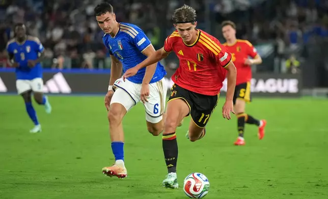 Belgium's Charles De Ketelaere runs with the ball away from Italy's Diego Coppola during the Nations League soccer match between Italy and Belgium in Rome, Friday, Sept. 25, 2026. (AP Photo/Andrew Medichini)