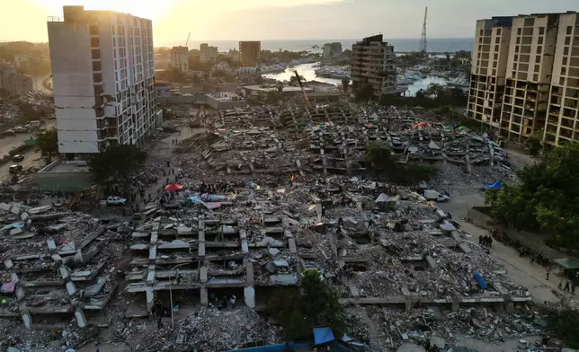FILE - Buildings lie in ruins after twin earthquakes in La Guaira, Venezuela, July 7, 2026. (AP Photo/Ariana Cubillos, File)