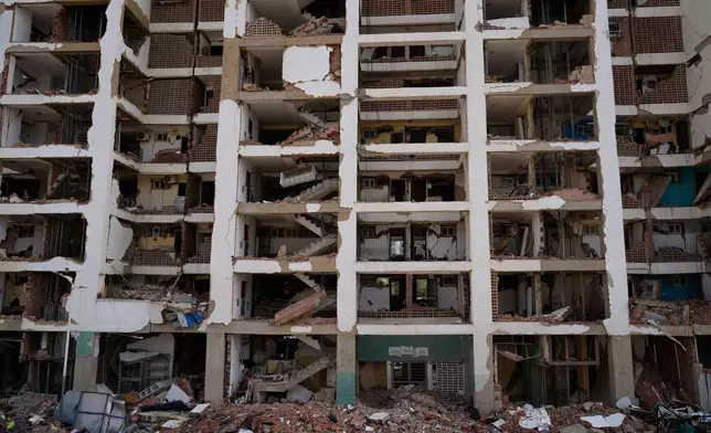 FILE - An O-P-P housing tower built as part of a government program, which partially collapsed after twin earthquakes, stands in La Guaira, Venezuela, July 2, 2026. (AP Photo/Ariana Cubillos, File)