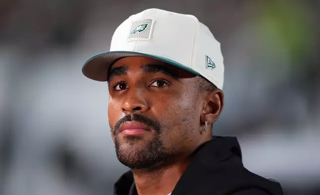 Philadelphia Eagles quarterback Jalen Hurts participates in an interview on the sidelines during the first half of a preseason against the Cincinnati Bengals on NFL football game Friday, Aug. 28, 2026, in Philadelphia. (AP Photo/Chris Szagola)