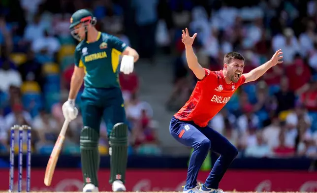 FILE - England's bowler Mark Wood gestures after a delivery against Australia's captain Mitchell Marsh during an ICC Men's T20 World Cup cricket match at Kensington Oval in Bridgetown, Barbados, Saturday, June 8, 2024. (AP Photo/Ricardo Mazalan, File)