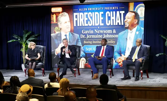 California Gov. Gavin Newsom, second from left, speaks during a fireside chat at Allen University, Friday, Sept. 4, 2026, in Columbia, S.C. (AP Photo/Mic Smith)