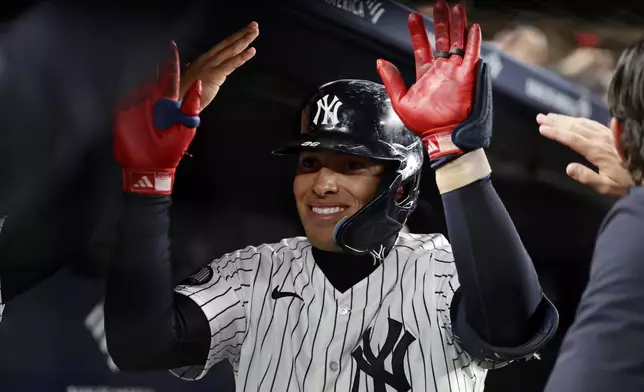 New York Yankees' George Lombard Jr. reacts after hitting a two-run home run during the eighth inning of a baseball game against the Tampa Bay Rays, Thursday, Sept. 24, 2026, in New York. (AP Photo/Adam Hunger)