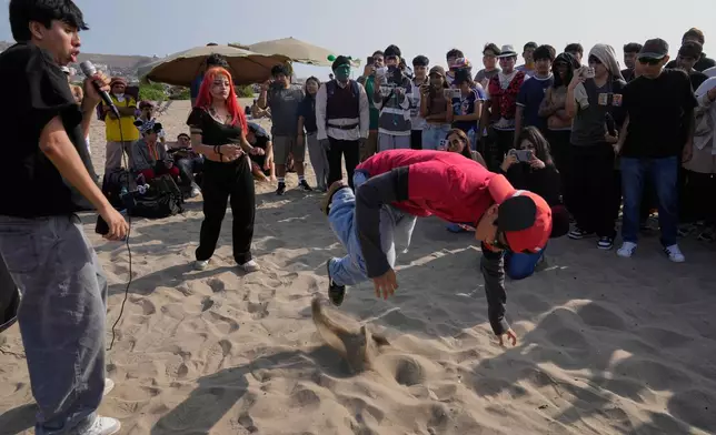 “Ciclope,” or Cyclops and "Chamo," or dude face off in an aura-farming battle at Las Sombrillas beach in Lima, Peru, on Aug. 29, 2026. (AP Photo/Martin Mejia)