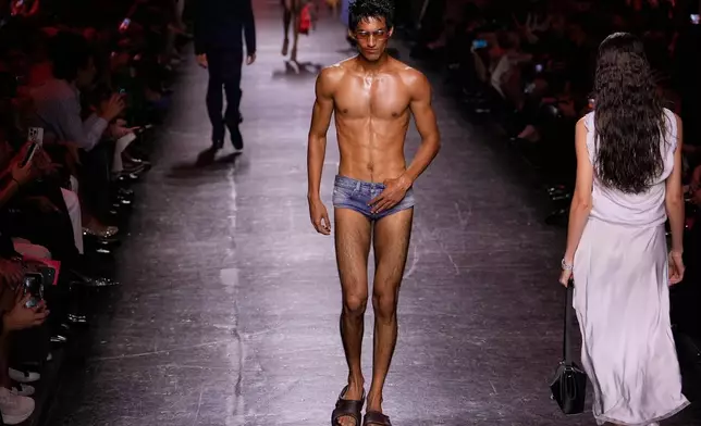 Models wear creations part of the Diesel women's Spring-Summer 2027 collection presented in Milan, Italy, Tuesday, Sept. 22, 2026. (AP Photo/Luca Bruno).