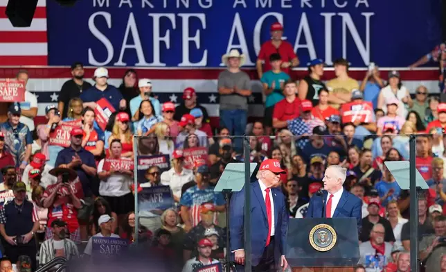 Michael Whatley, North Carolina senatorial candidate, right, and President Donald Trump speak during a campaign rally at the Gastonia Municipal Airport, Wednesday, Sept. 16, 2026, in Gastonia, N.C. (AP Photo/Matt Kelley)